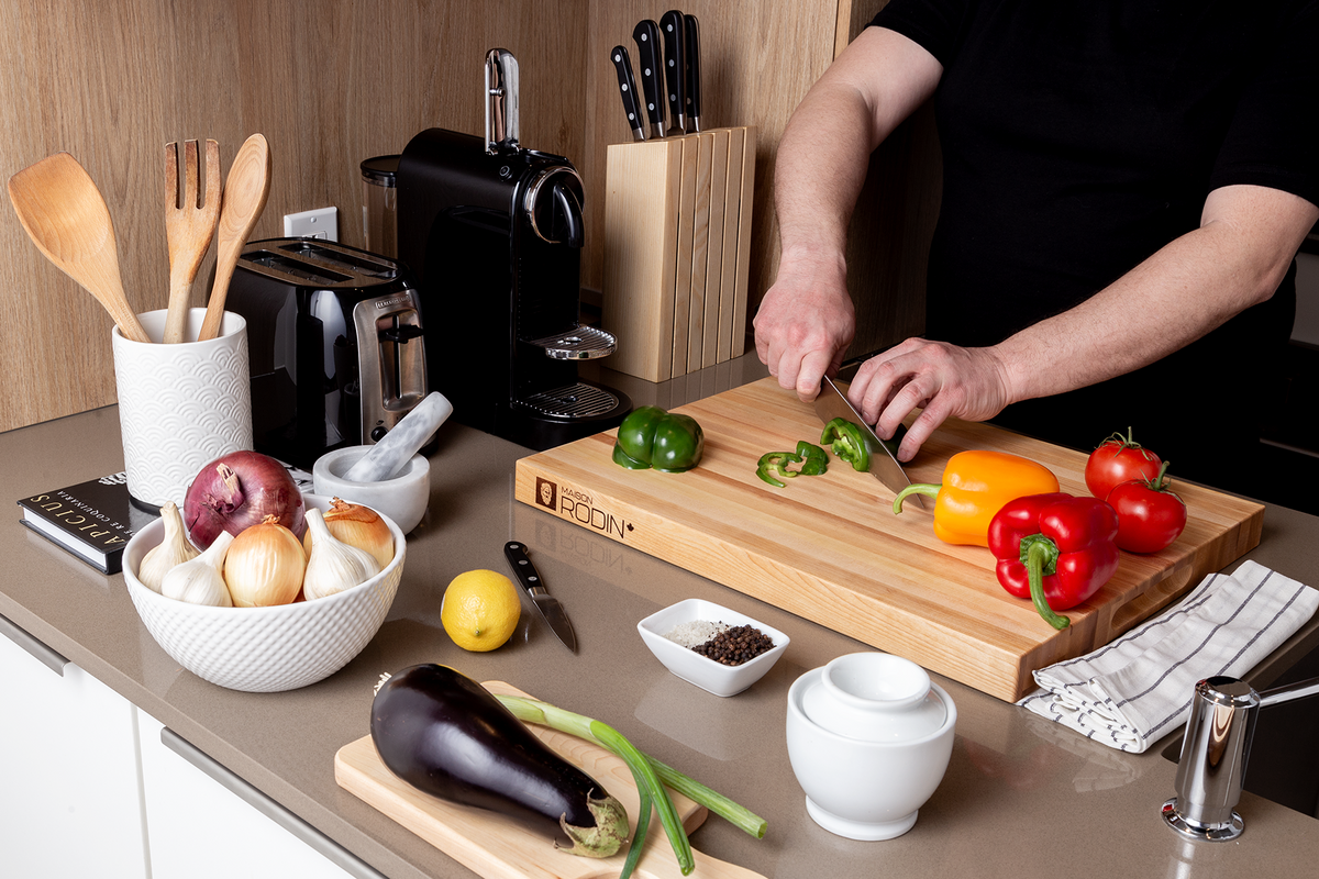 Maple edge-grain butcher block, 20 × 16 in on a kitchen counter with vegetables and a chef’s knife