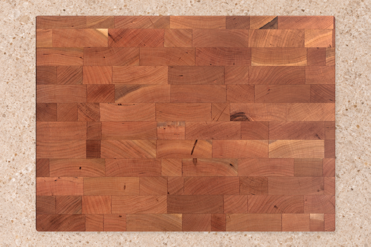 An illustrated cherry-wood board after oiling, with a richer tone