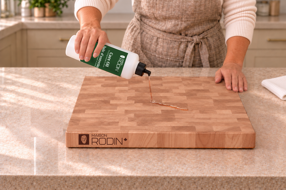 A small amount of MAISON RODIN Care Oil is poured onto a clean, dry wooden board
