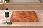 MAISON RODIN Care Oil and Care Cream beside a wooden board. Sold separately.