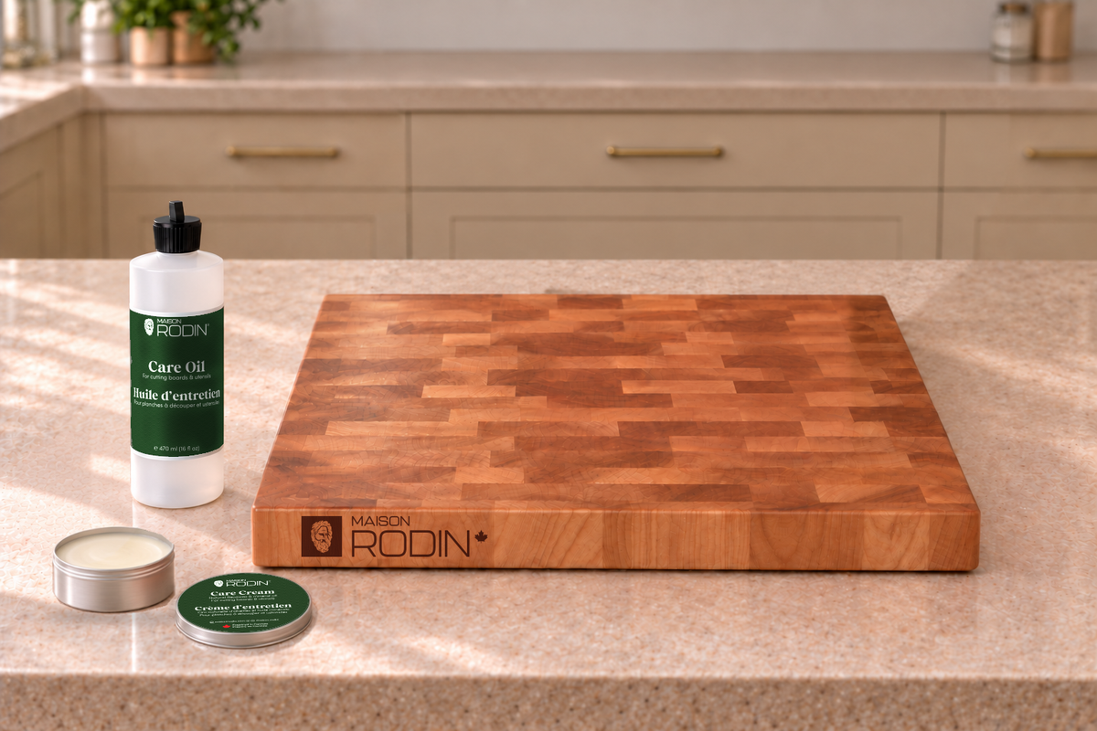 MAISON RODIN Care Oil and Care Cream beside a wooden board. Sold separately.