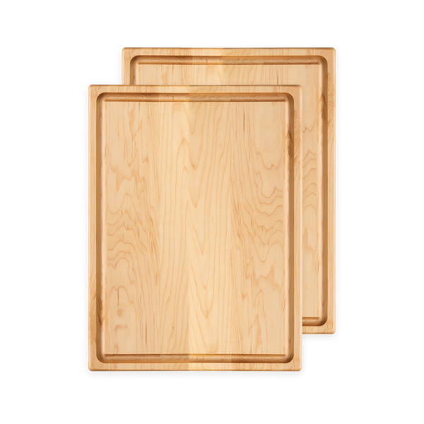 Overhead view of the set of two 16 × 12 inch maple cutting boards with juice groove