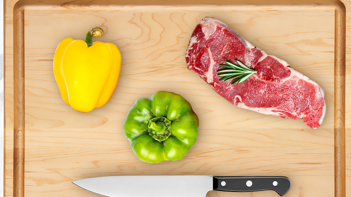 20 × 14 inch maple cutting board with juice groove, steak, peppers and chef's knife