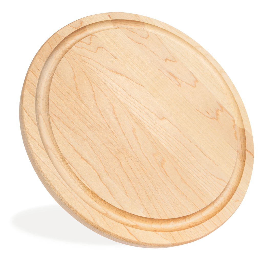 Vue de côté de la planche à steak ronde en érable avec rigole, de 11 po