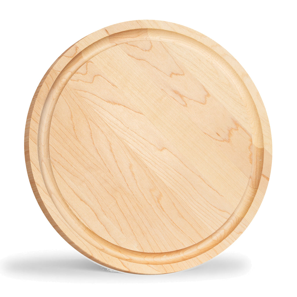Round maple steak board standing upright, viewed at an angle