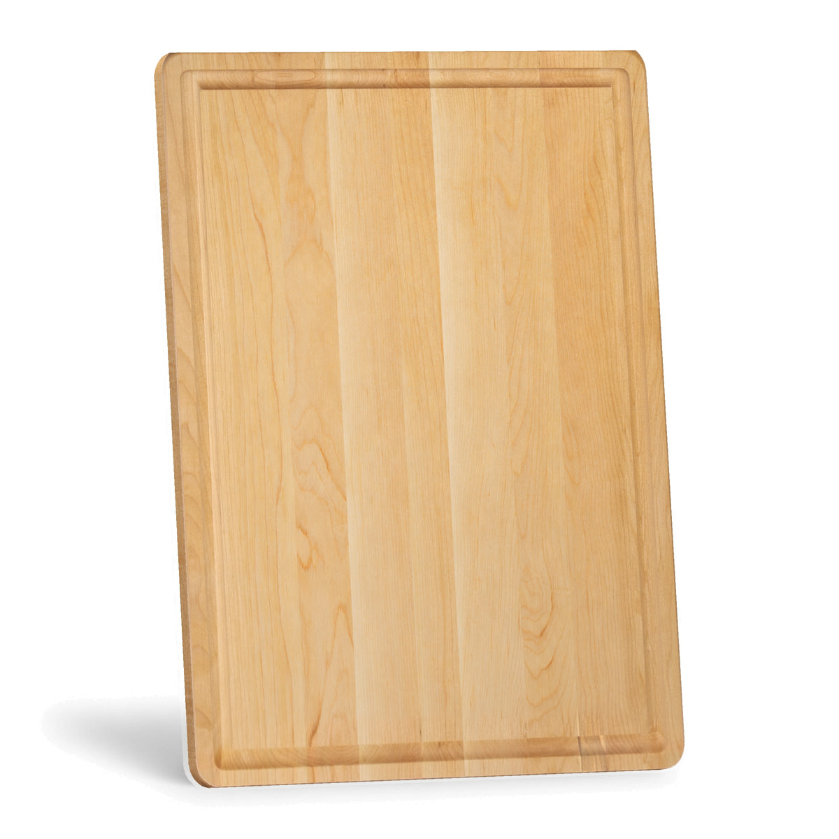 Maple cutting board with a juice groove standing on its short edge, viewed at an angle