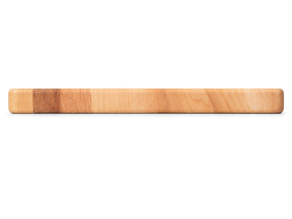 Side view of the maple serving board, 16 × 8 × 0.75 inches