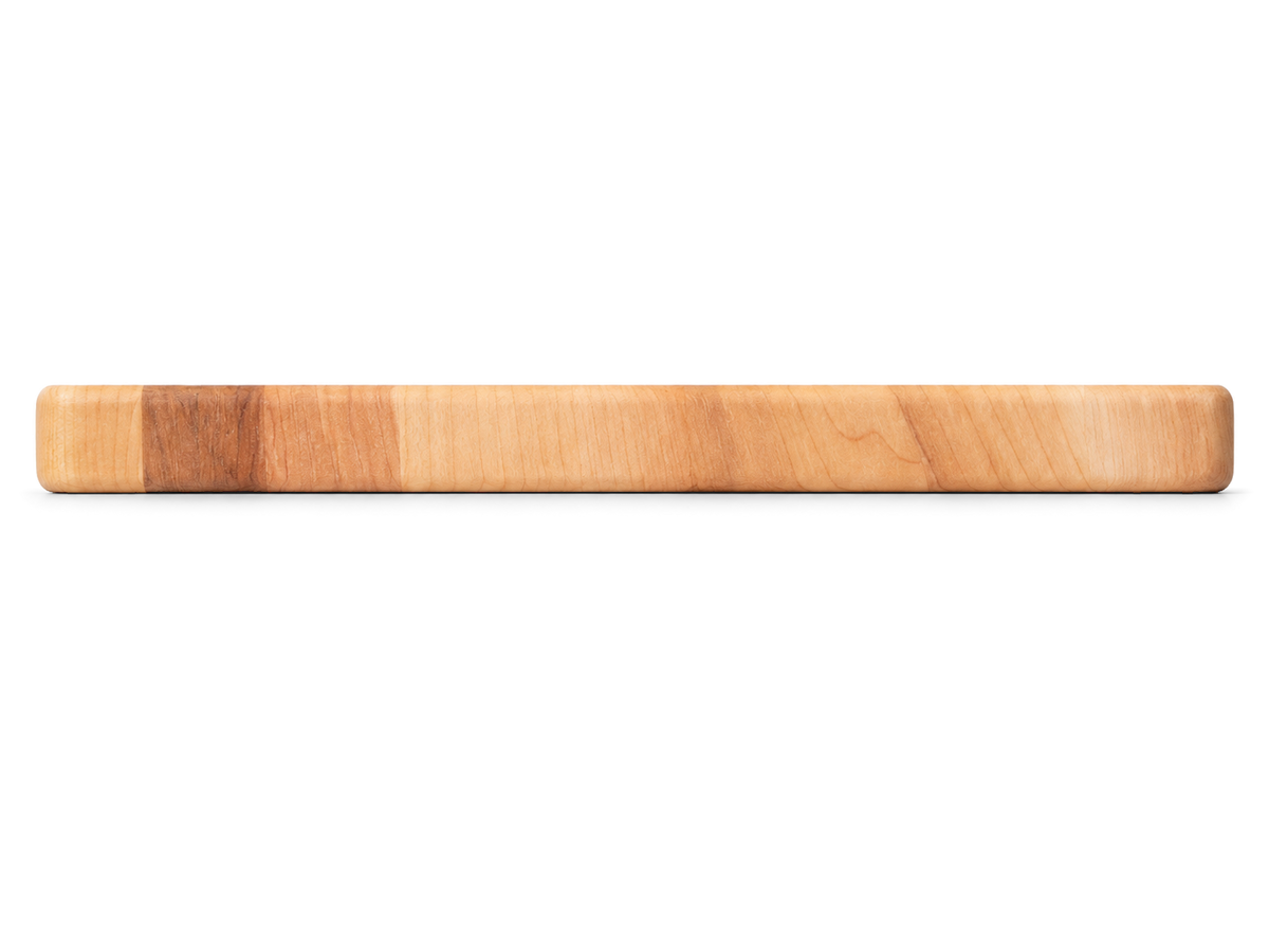 Side view of the maple serving board, 16 × 8 × 0.75 inches