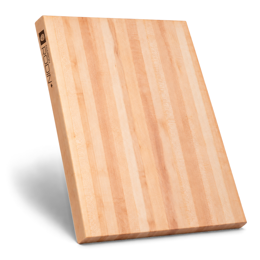 Maple edge-grain butcher block standing on its short edge, with the brand mark and side grip visible