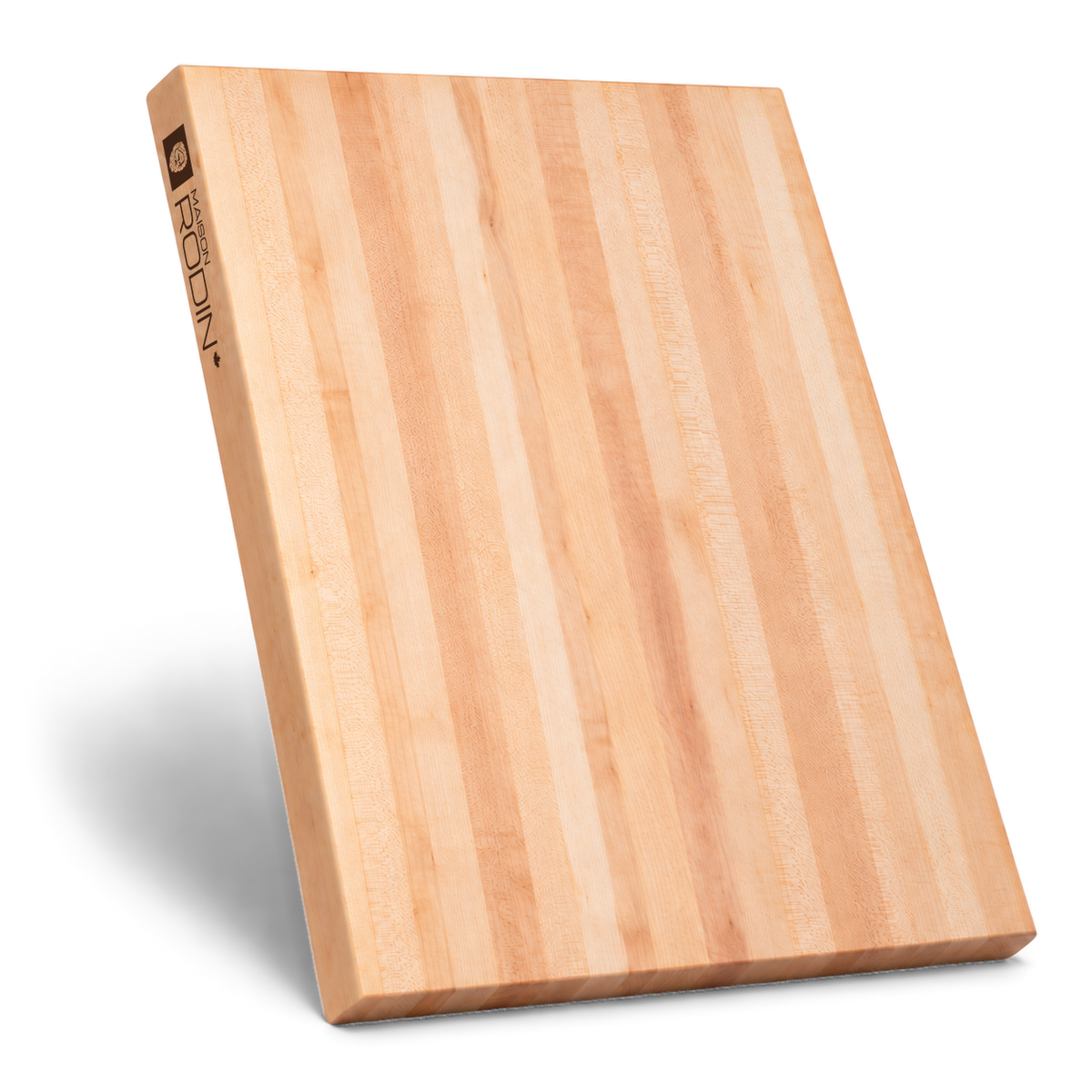 Maple edge-grain butcher block standing on its short edge, with the brand mark and side grip visible