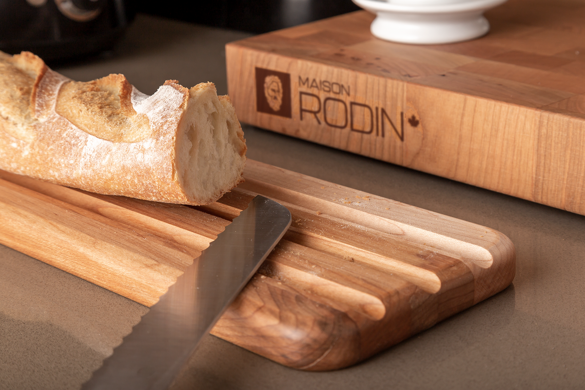 Wooden baguette board, 24 × 5 in with bread, butter and a knife