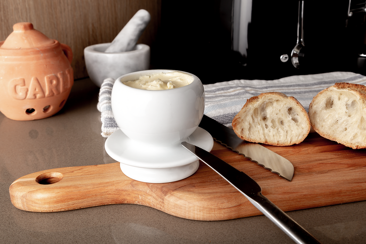 Wooden baguette board, 24 × 5 in with bread, butter and a knife